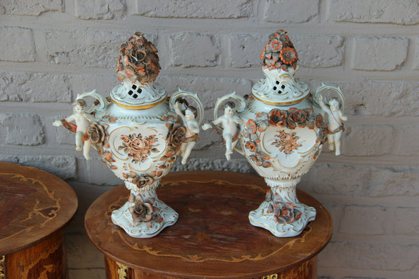 German Schierholz marked porcelain cherub angel lidded Vases majolica flowers