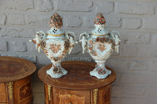 German Schierholz marked porcelain cherub angel lidded Vases majolica flowers