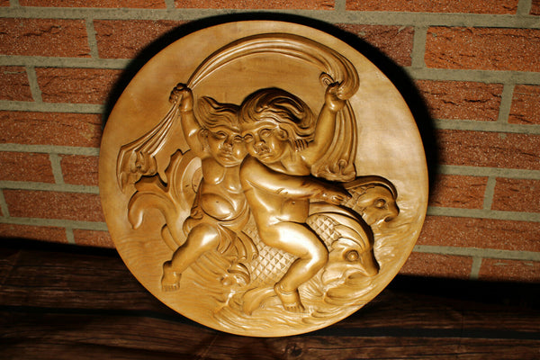 Vintage italian wood carved putti cherub dolphin riding round wall panel plaque