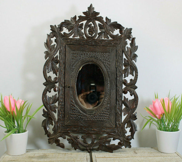 Antique Black forest wood carved apothecary wall cabinet with mirror rare