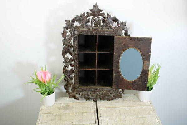 Antique Black forest wood carved apothecary wall cabinet with mirror rare