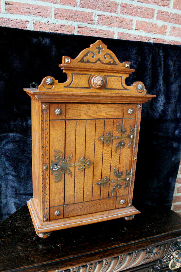 Antique French wood carved neo gothic lion head apothecary cabinet