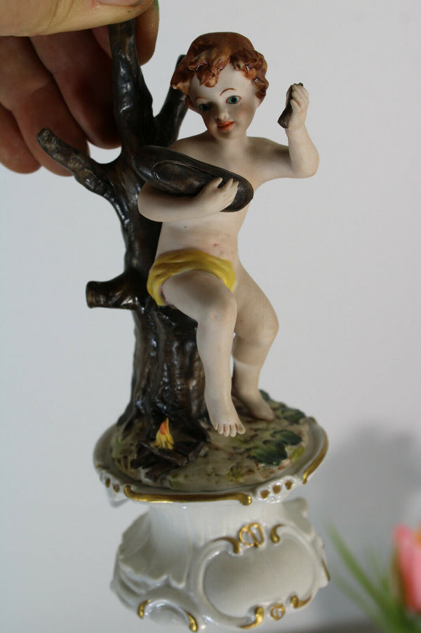 vintage capodimonte marked Figurine statue putti fire making