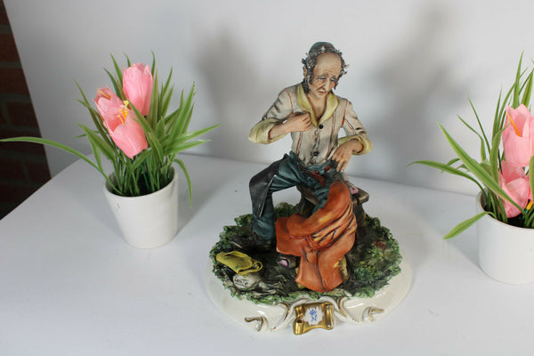 Vintage capodimonte Conte signed porcelain statue leather worker figure