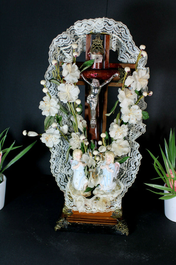 Antique french crucifix wood carved with bisque angels silk flowers