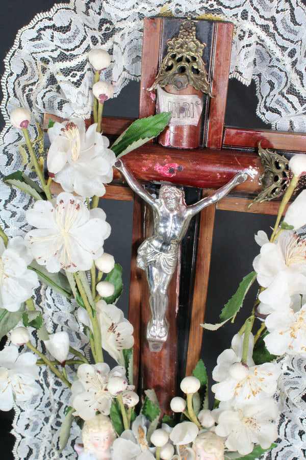 Antique french crucifix wood carved with bisque angels silk flowers