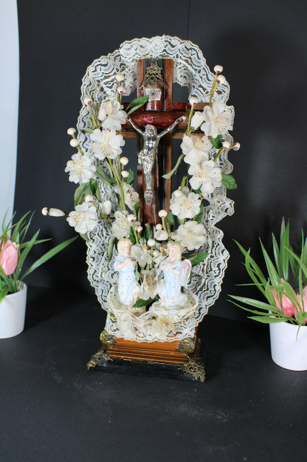 Antique french crucifix wood carved with bisque angels silk flowers