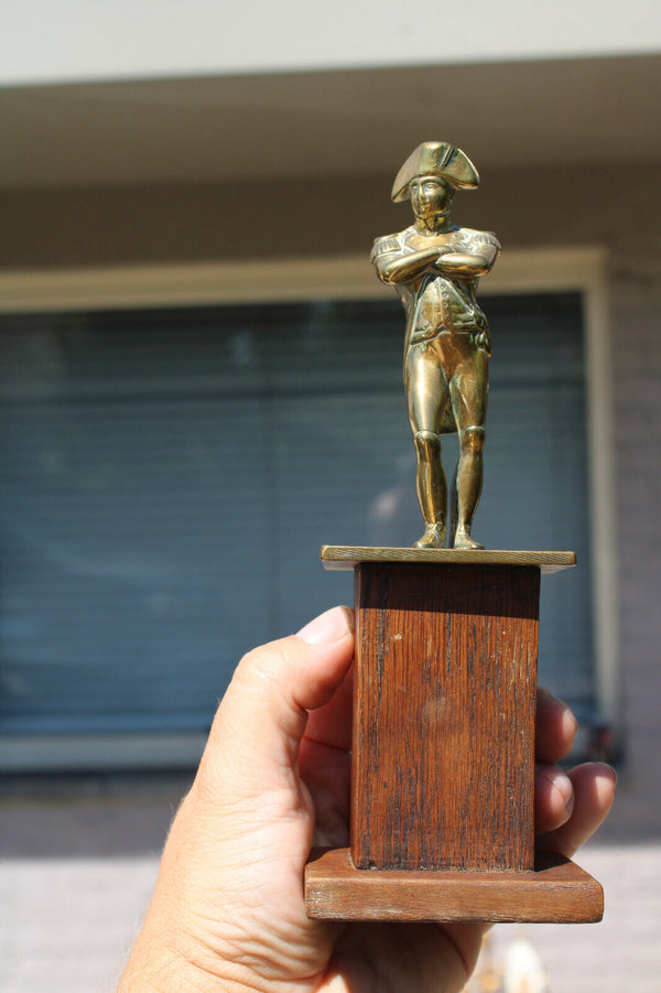 Antique brass napoleon statue on wood pedestal