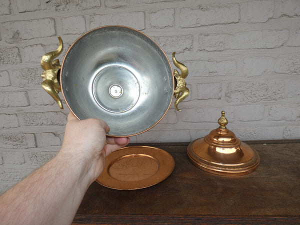 Vintage tin tureen centerpiece bowl with ram heads on plate