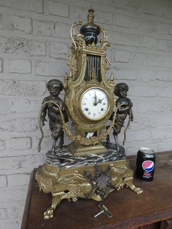 Italian  black marble bronze faun putti figural mantel clock 1970 rare