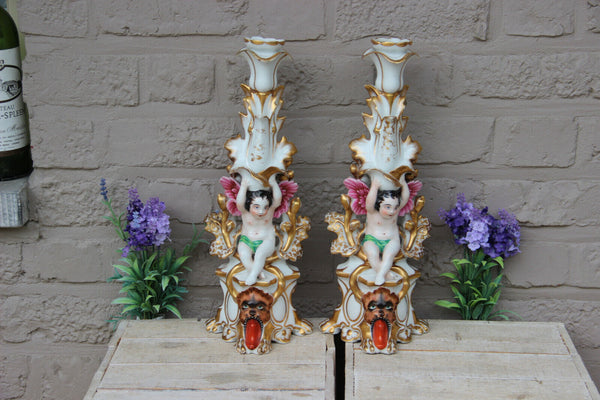 Rare pair antique Vieux paris porcelain putti Lion Candle holders vases