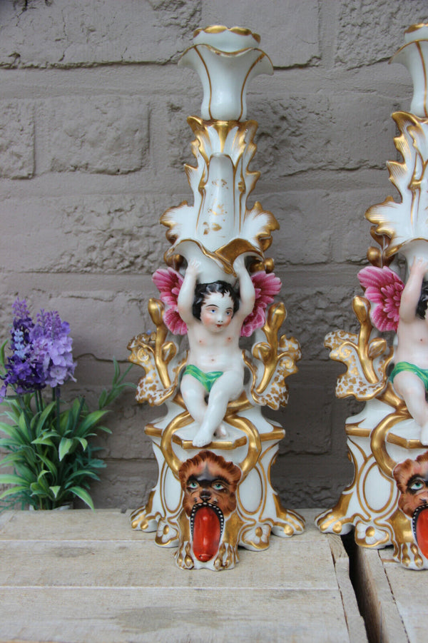 Rare pair antique Vieux paris porcelain putti Lion Candle holders vases