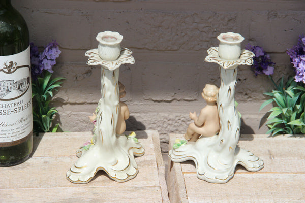 PAIR vintage Dresden porcelain marked candle holders putti figurine