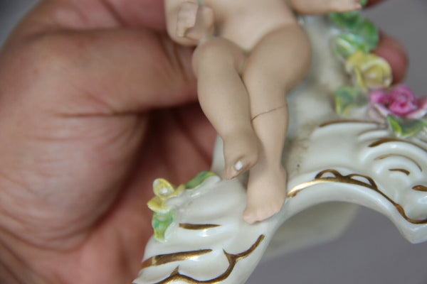 PAIR vintage Dresden porcelain marked candle holders putti figurine