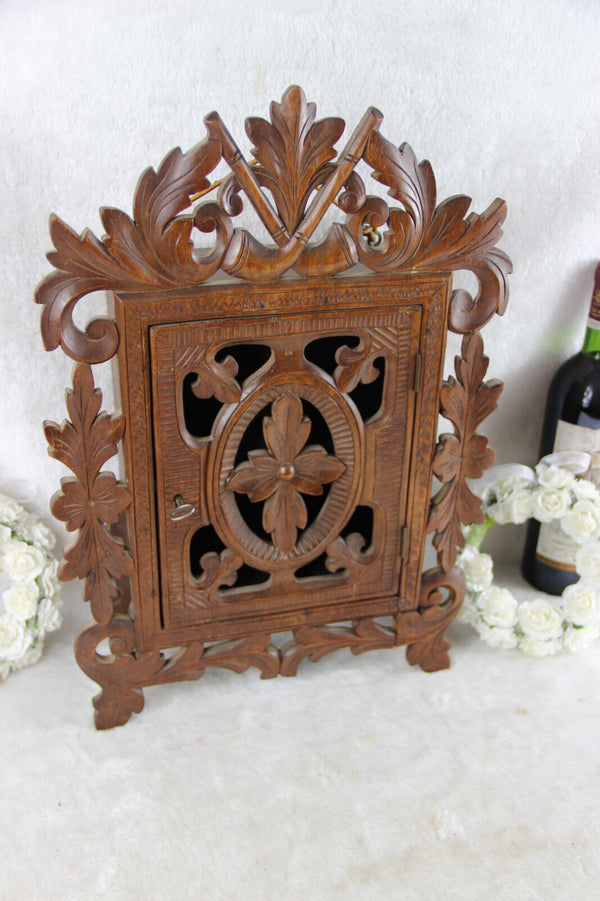 Antique black forest wood carved apothecary wall cabinet pipes tobacco