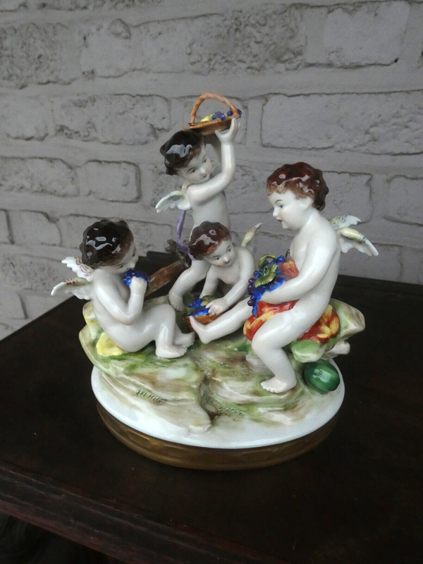 Antique German Volkstedt marked porcelain putti cherub figurine group statue