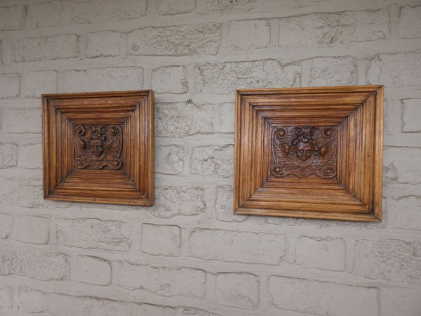 pair antique 19thc wood carved putti cherub head portrait plaque wall