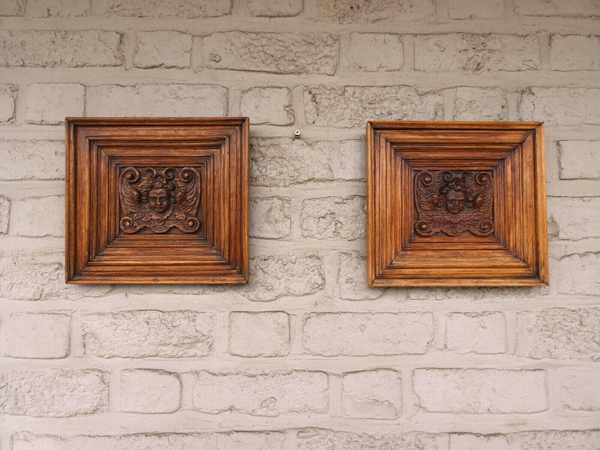 pair antique 19thc wood carved putti cherub head portrait plaque wall